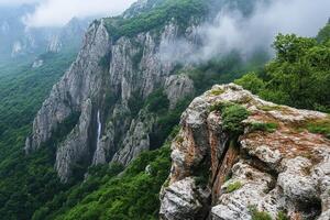 A view of the mountains and a waterfall photo