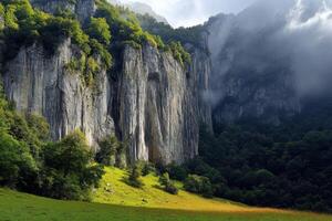 A mountain with tall cliffs and green grass photo