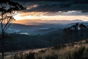 A view of a sunset over a mountain range photo