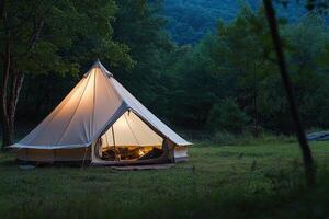 A tent with a fire in it in the woods photo
