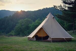 A tent is set up in the middle of a field photo