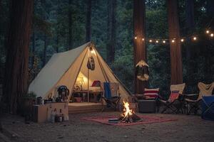A tent in the woods with a fire pit photo