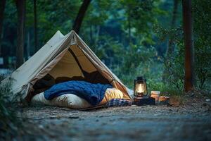 A tent with a blanket and a lamp in the woods photo