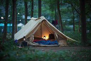 A tent in the woods with a light on photo