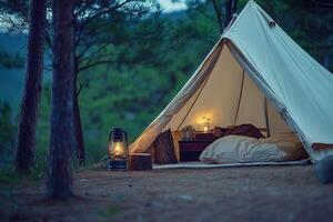 A tent with a lamp and pillows in the woods photo
