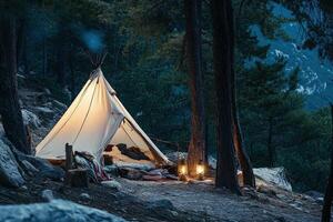 A tent is set up in the woods at night photo