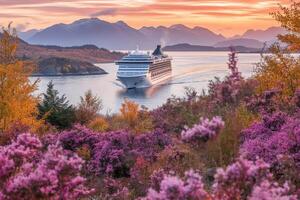 Cruise ship sailing through the mountains at sunset photo