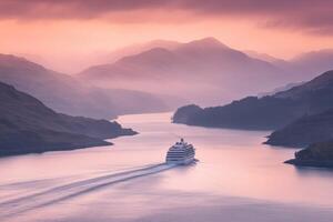 A cruise ship traveling through the water near mountains photo