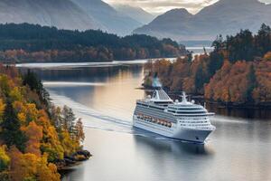 A cruise ship traveling through the water near mountains photo