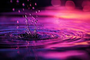Water droplets falling into a purple and pink background photo