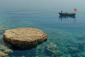 A boat floating in the water photo