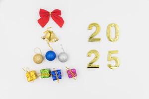 Gold 2025 numerals on a white background. 2025 New Years Eve Celebration, Holiday background Happy New Year 2025. Numbers of year 2025, celebrating New Year holiday, Space for text photo