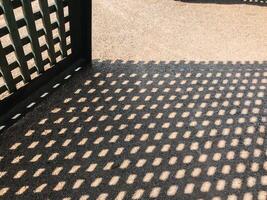 A black and white photo of a patio with a black and white patterned floor