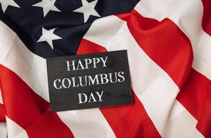 Black sign with the words Happy Columbus Day photo