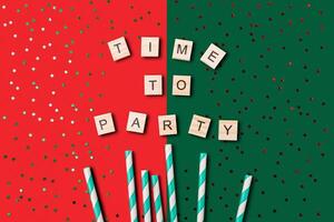 Festive scene with a red and green background, and a large pile of confetti photo