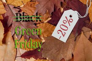 Pile of leaves with a tag that says Black Green Friday and 20 off photo