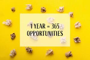 Yellow background with a bunch of crumpled paper on it photo