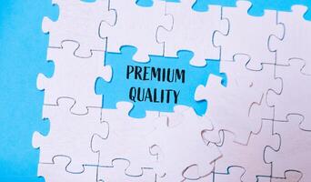 Puzzle with a piece missing and the word premium quality written in the gap photo