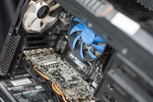 Inside a modern computer showcasing a cooling system, graphics card, and intricate hardware components in a tech workspace photo