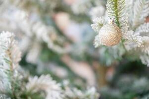 Christmas tree decorated with red and white stars and balls. Selective focus photo