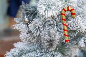 Christmas tree decorated with red and white stars and balls. Selective focus photo