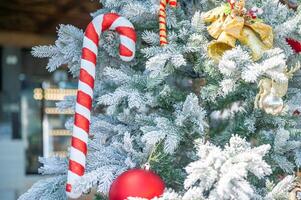 Christmas tree decorated with red and white stars and balls. Selective focus photo