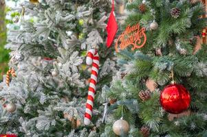 Christmas tree decorated with red and white stars and balls. Selective focus photo