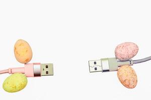 Two pink gray usb cables for connection on white photo