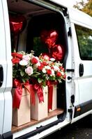 Open side door of a white delivery minivan with bouquets of roses, and a heart-shaped red balloons, close-up view, concept delivery service photo