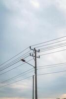 A street light is on top of a telephone pole photo