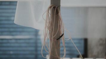 A white towel hanging from a pole photo