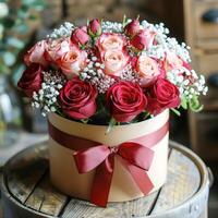 Red and white roses in a round box photo
