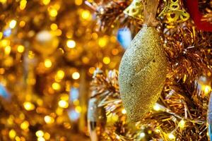 Luxurious Golden Christmas Tree Adorned with Sparkling Ornaments for the Holidays photo