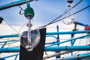 Fishing Bulbs Hanging on Wooden Structures with Colorful Details in a Thai Port at Chonburi, Thailand. photo