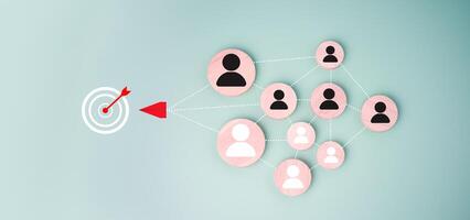 Dartboard and red arrow connection linkage with human icon for customer focus target group and customer relation management concept, Target customer, Marketing plan and strategies. photo