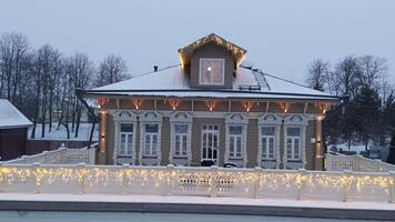 Aerial View of Illuminated Houses in Village in Snow video