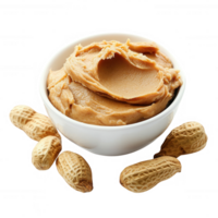 Delicious creamy peanut butter served in a bowl with whole peanuts around. png