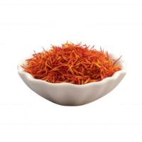 A close-up view of vibrant saffron threads in a white bowl, showcasing their rich color. png