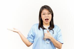 Showing and Presenting Product on Open Palm Of Asian Young Doctor Isolated On White Background photo