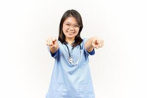 Pointing to Camera or I Want You Gesture Of Asian Young Doctor Isolated On White Background photo