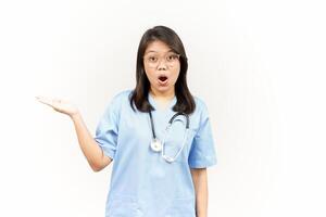Showing and Presenting Product on Open Palm Of Asian Young Doctor Isolated On White Background photo