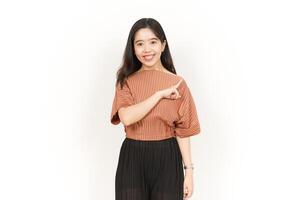 Showing Product and Pointing Side Of Beautiful Asian Woman Isolated On White Background photo