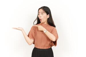 Showing and Presenting Product on Open Palm Of Beautiful Asian Woman Isolated On White Background photo