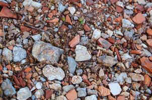 Stones of different colors. Coarse texture. Material for construction. Cobbles of different sizes. photo