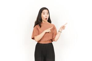 Presenting and Pointing Side Product or Copy Space Of Beautiful Asian Woman Isolated On White Background photo