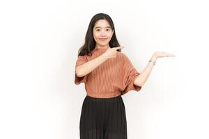 Showing and Presenting Product on Open Palm Of Beautiful Asian Woman Isolated On White Background photo