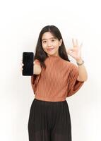 Showing and Presenting Apps On Blank Screen Smartphone Of Beautiful Asian Woman Isolated On White Background photo
