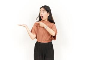 Showing and Presenting Product on Open Palm Of Beautiful Asian Woman Isolated On White Background photo