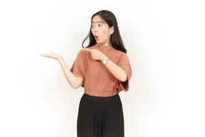 Showing and Presenting Product on Open Palm Of Beautiful Asian Woman Isolated On White Background photo