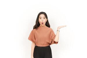 Showing and Presenting Product on Open Palm Of Beautiful Asian Woman Isolated On White Background photo